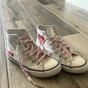 Kids converse high top tennis shoes with red heart details and love laces